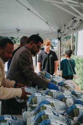 Distribution of Thanksgiving turkeys provided by PMI Foods.