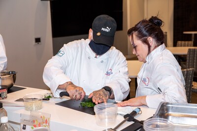 Chef Jennifer Coppins and Chef Mellisa Rucinski working on their chopping skills during Restaurant Ready Training.