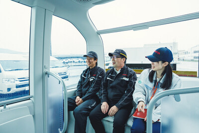 Three employees take a ride on the Toyota e-Palette, powered by May Mobility's autonomous driving technology