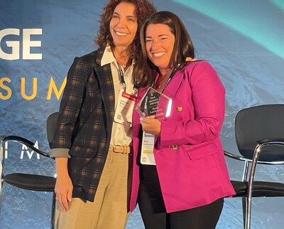 Beth Lachance, CEO of Global Medical Virtual Assistants, proudly accepts the prestigious Vistage Impact CEO Award alongside Vistage Chair Julianne Roth