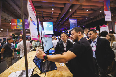 Members of the Macao Technological Innovation Exploration in Lisbon visit exhibit booths and share ideas with Portuguese tech enterprise representatives Nov. 12 at the Web Summit. (PRNewsfoto/Sands China Ltd.)