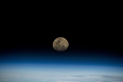 A waxing gibbous moon rises over the blue glow of Earth’s horizon as the International Space Station orbited 264 miles above the Indian Ocean on Nov. 13, 2024. Credit: NASA