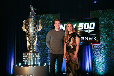 Josef Newgarden, 2024 Indianapolis 500 winner, and Michelle Collins, Global Director, Marketing and Public Relations, BorgWarner, pose with the Borg-Warner Trophy | Borg-Warner Trophy Unveil | December 4, 2024