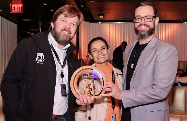 Carel Bekker, Head of AWS Services at EPI-USE; Ana Carolina Zanoni, Marketing Manager at Valcann, an EPI-USE company; and Renato Andrade, Chief Financial & Operating Officer and Co-Founder of Valcann, an EPI-USE company, at the AWS Partner Awards Gala on December 2, 2024, in Las Vegas.