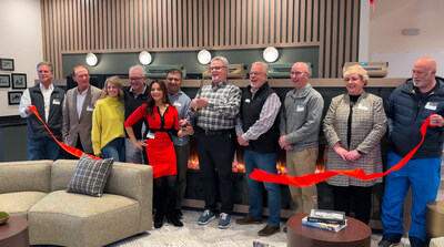 Ribbon cutting ceremony at Article No. 7 grand opening. Pictured Drs. Basir ad Mohiba Tareen and Jim LaValle of Tareen Development Partners, Bauer Construction, Momentum Design Team, Mayor John Monge and NSP City Council Members.