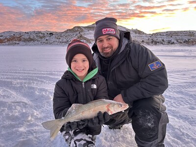 Winter blankets dozens of lakes and rivers in ice throughout North Dakota making ice fishing one of the most exhilarating ways to embrace the season. Two anglers share their catch at Lewis and Clark State Park near Epping, North Dakota. Photo Credit: North Dakota Tourism / Brock Mitchell