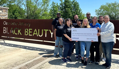 Populus Financial Groups presents a $84,913 donation to Steve McVeigh, Vice President of Business Development and Corporate Relations at the Humane Society of the United States