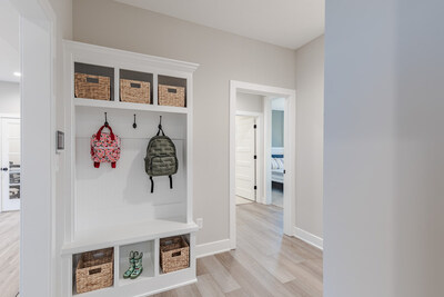 A small alcove for shoes, key drop or a backpack valet improve home organization.