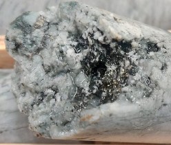 Photo 3: Closeup vuggy quartz vein with pyrite mineralization in hole WD24-38. (CNW Group/Omineca Mining and Metals Ltd.)