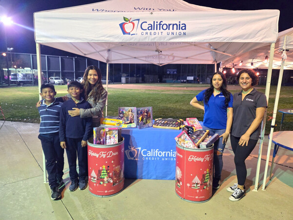 California Credit Union volunteers distribute gifts to Los Angeles Boys & Girls Club families and community members during the organization’s annual holiday event. The credit union provided over 525 new toys donated by the credit union, its employees and members during a branch drive.