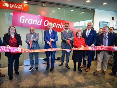 Scientific Systems CEO Dr. Raman Mehra, Scientific Systems President Kunal Mehra, United States Senator Edward Markey (D-MA) and guests participate in a ribbon cutting ceremony to open the company's new headquarters.