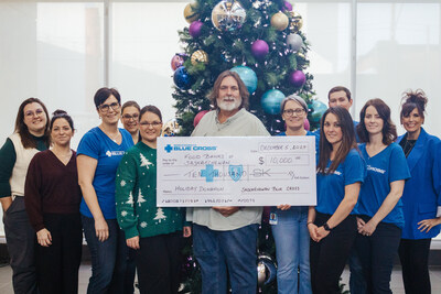 Food Banks of Saskatchewan accept a $10,000 donation from Saskatchewan Blue Cross (CNW Group/Saskatchewan Blue Cross)