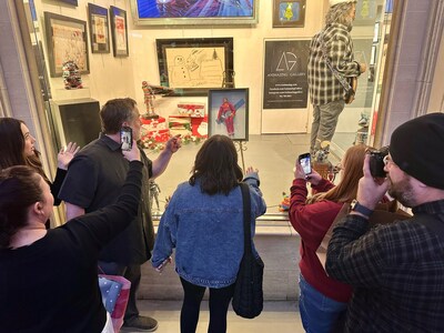 Crowds gather outside Animazing Gallery at Grand Canal Shoppes at The Venetian Resort Las Vegas to see The Six Million Dollar Man with Banana art for sale for $6 million.