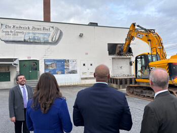 City Officials gather to watch the demo