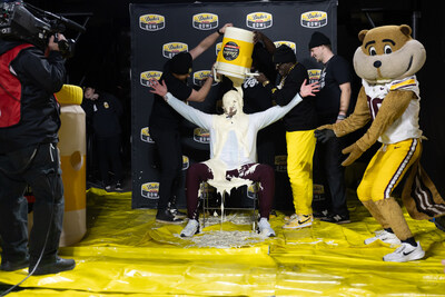 Flavor Flav performs the post-game mayo dump at the Duke's Mayo Bowl. Winning Minnesota Coach P.J. Fleck welcomes the dump of Duke's with open arms.