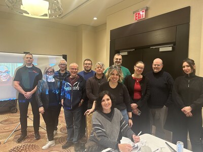 The CAAT-A bargaining team, representing over 15,000 college faculty across Ontario, is joined by OPSEU/SEFPO President JP Hornick in signing a Memorandum of Agreement with the College Employer Council (CEC.) (CNW Group/Ontario Public Service Employees Union (OPSEU/SEFPO))