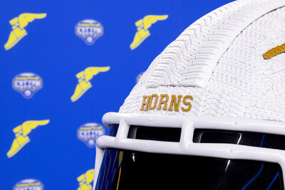 The cutting-edge tread of the Goodyear Assurance WeatherReady® 2 tire runs down the center of the Texas team helmet tire art sculpture commissioned by Goodyear for the 89th Goodyear Cotton Bowl Classic. This commissioned tire art will appear on-site as Texas competes against Ohio State at the Goodyear Cotton Bowl Classic on Friday, Jan. 10. (Brandon Wade/AP Images for Goodyear)