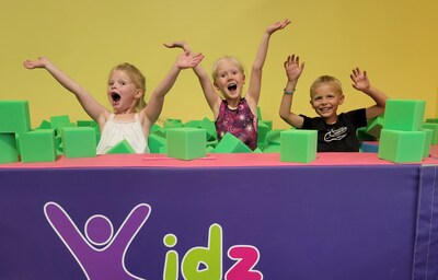 Kids playing in the foam pit at Kidz Gym