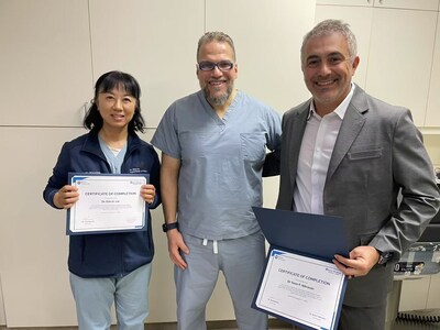 Dr. Nikravan and Dr. Lin getting MWA Certificates