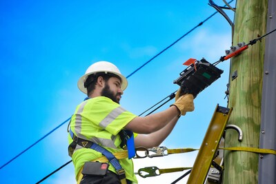 Comcast technician working on installation