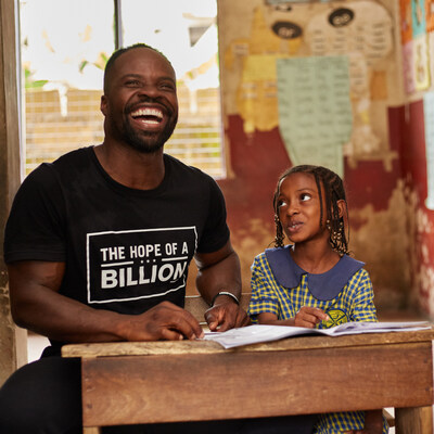 Akwasi Frimpong of Hope of a Billion works with a student in Africa.