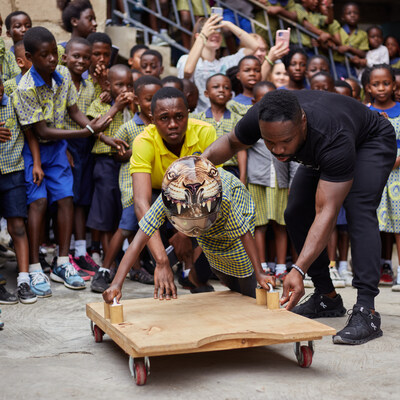 Akwasi Frimpong of Hope of a Billion teaches students about skeleton racing.
