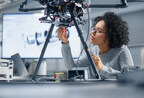 Woman in STEM working on a robot.