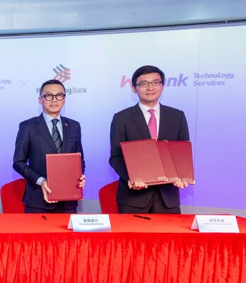 (L-R) Andrew Jong, Managing Director of Personal Financial Services at Hong Leong Bank and Joe Chen, Director of WeBank Technology Services at the Strategic Partnership Signing Ceremony at WeBank Technology Services' Hong Kong base on January 16, 2025