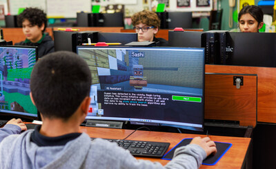 Students engaged in gaining critical future skills using AI Ready Skills.