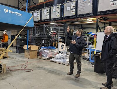 U.S. Rep. Joe Courtney is briefed by ThayerMahan VP of Persistence Surveillance Systems Dan Lombardo on the surveillance capabilities of ThayerMahan's Outpost unmanned surface vessel.