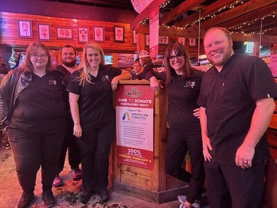 Second from left, Emily McMahan, AuD and ATA board member, with Alaska Hearing & Tinnitus Center staff at Texas Roadhouse in Anchorage, Alaska, at last year's dine-to-donate event.