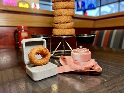 Are you ready to pop the question? Get engaged with one of Red Robin’s fan-favorite golden onion rings for the chance to win a diamond engagement ring of choice, awarded as $10,000 in gift cards to a jewelry store and a $180 Red Robin gift card! See full contest details at redrobin.com/lovebird-combo (PRNewsfoto/Red Robin Gourmet Burgers, Inc.)