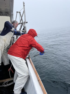 Tom helps GMGI’s Matt Harke retrieve the sediment grabber in Stellwagen Bank