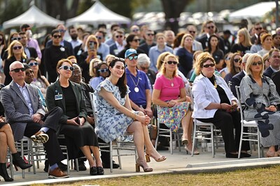 Guests gather at a press conference to unveil the new Manning Family Children's sign on the hospital in New Orleans.