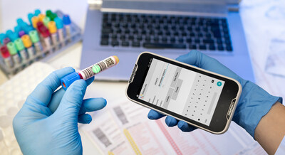 technician hands scanning bar codes on biological sample tube in the lab of blood bank
