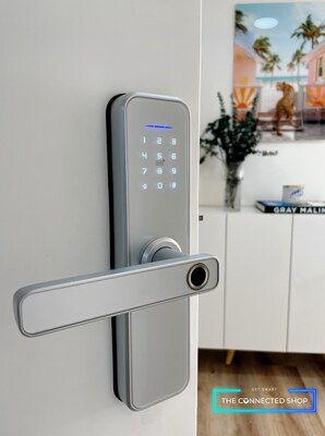 Smart Door Lock silver color on apartment entry door opening