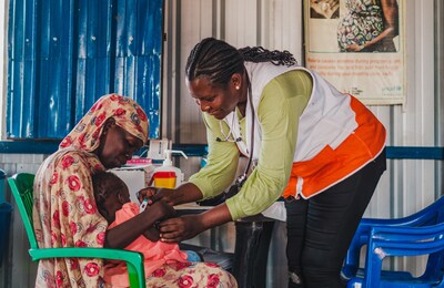World Vision worker checks an infant for malnutrition at a clinic in South Sudan.