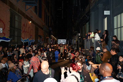 Guests gather in Cortlandt Alley near the Walker Hotel before the Custo Barcelona runway show at New York Fashion Week. (Photo by Oliver Archer))