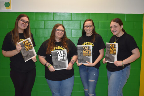 Grant Recipient Narrows High School shows off their yearbook.