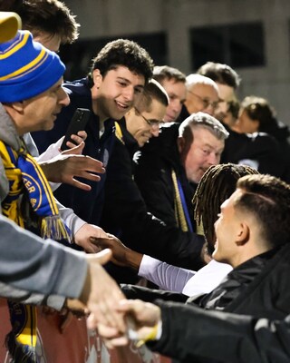 Westchester SC players with fans