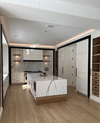 A seamless blend of innovation and craftsmanship, this modern kitchen by Cambridge Kitchens Mfg. showcases expertly designed cabinetry with sleek, integrated storage solutions. The clean lines, custom paneling, and precision detailing reflect the brand's commitment to functional elegance, redefining contemporary luxury in kitchen design.