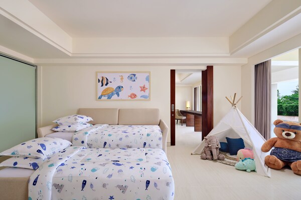 Junior Family Suite at Sheraton Bali Kuta, featuring two separate sleeping areas for comfort and privacy. Parents can unwind in their private king-bedroom, while kids enjoy their sofa bed and fold-out chair—all within a spacious 62 sqm suite. Junior Family Suite at Sheraton Bali Kuta, featuring two separate sleeping areas for comfort and privacy. Parents can unwind in their private king-bedroom, while kids enjoy their sofa bed and fold-out chair—all within a spacious 62 sqm suite. Easter