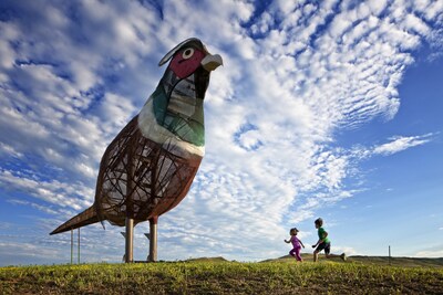 Pheasants on the Prairie, one of the larger-than-life sculptures along the Enchanted Highway in North Dakota, features a 40-foot-tall rooster, a 35-foot-tall hen, and two chicks created by Gary Greff. The Enchanted Highway is just one of the must-see sights on a North Dakota road trip this year. Credit: North Dakota Tourism