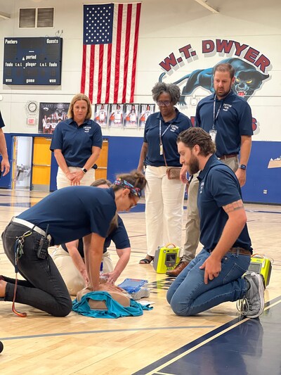 William T. Dwyer High School staff demonstrate life-saving skills learned through the completion of the Project ADAM training provided by the Nicklaus Children's Heart Institute team.