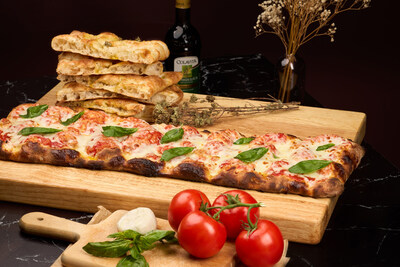 Angelina Bakery’s classic Margherita pinsa topped with tomato sauce, fresh mozzarella, and basil.