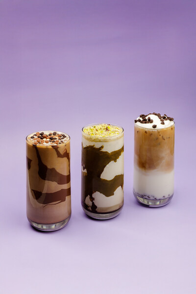 Angelina Bakery’s trio of signature lattes: the Dubai Chocolate Latte with chocolate pearls, the Pistachio Matcha Latte with pistachio dust, and the Cannoli Latte topped with whipped cream and chocolate chips.
