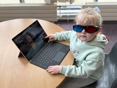 A young child engages with AmblyoFix therapy software using anaglyph glasses A young child engages with AmblyoFix therapy software using anaglyph glasses