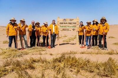 Yutong teams up with global customers, media representatives and volunteers to plant drought-resistant Haloxylon ammodendron trees in Minqin Desert, China (PRNewsfoto/Yutong Bus)