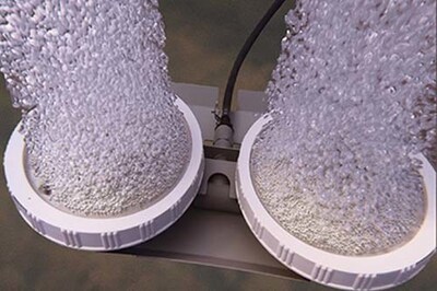 Diffusers placed on the bottom of the pond distribute air to oxygenate the water and create circulation.