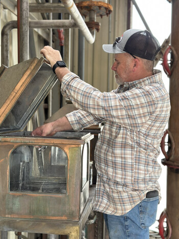 Terry Ballard, Assistant Master Distiller at Jackson Purchase Distillery, draws a fresh sample of newly distilled American Single Malt straight from the still. Every drop is a testament to precision, patience, and the pursuit of exceptional whiskey in the heart of Hickman, Kentucky. The American Single Malt Whiskey was produced for CaskX to offer exclusively to CaskX investors.